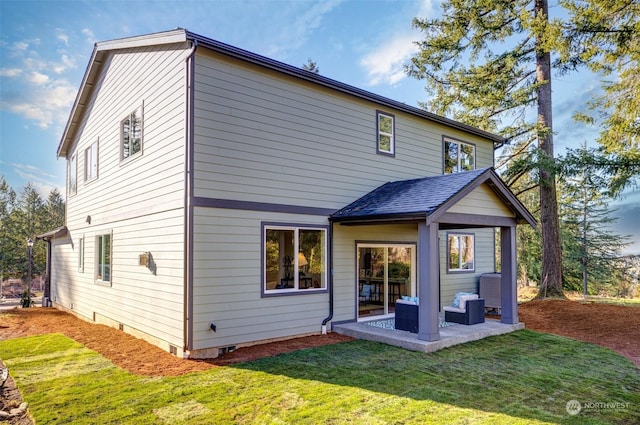 back of house featuring a yard, a shingled roof, central AC, and a patio