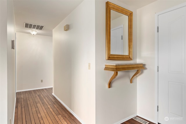 hallway with wood-type flooring