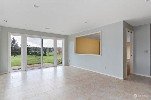 spare room with light tile patterned floors