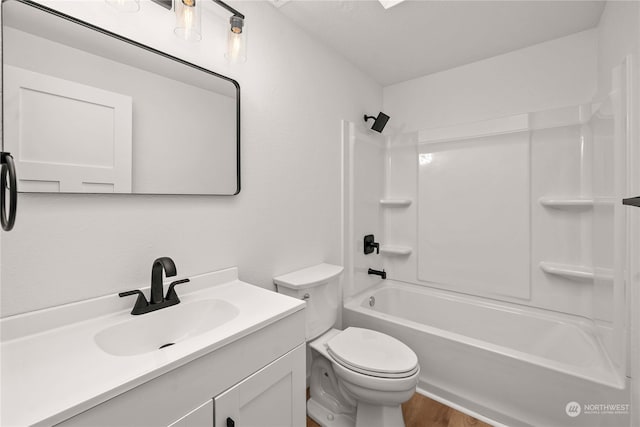 full bathroom featuring toilet, vanity, and bathing tub / shower combination