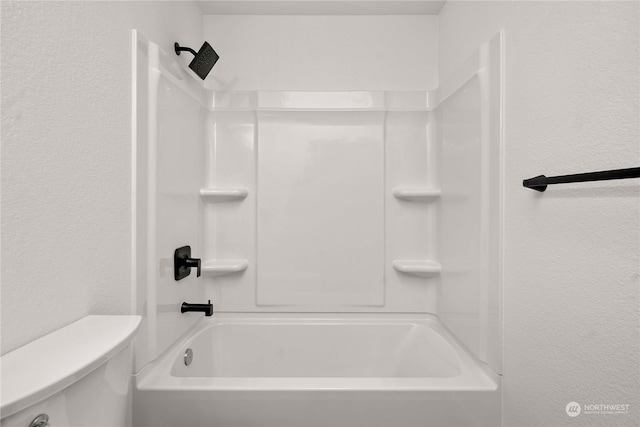 bathroom with toilet and tub / shower combination