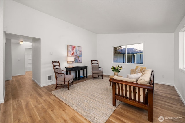 624 Geneva Ln SE, Olympia, WA 98513 - living area featuring visible vents, wood finished floors, and baseboards