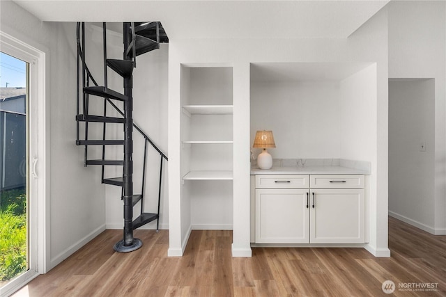 624 Geneva Ln SE, Olympia, WA 98513 - interior space featuring built in shelves, baseboards, and wood finished floors