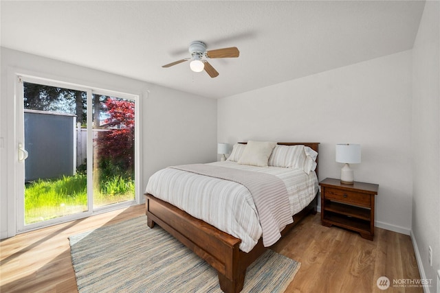 624 Geneva Ln SE, Olympia, WA 98513 - bedroom with a ceiling fan, baseboards, wood finished floors, and access to exterior