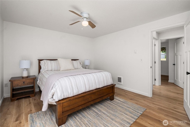 624 Geneva Ln SE, Olympia, WA 98513 - bedroom with baseboards, light wood-style floors, and ceiling fan