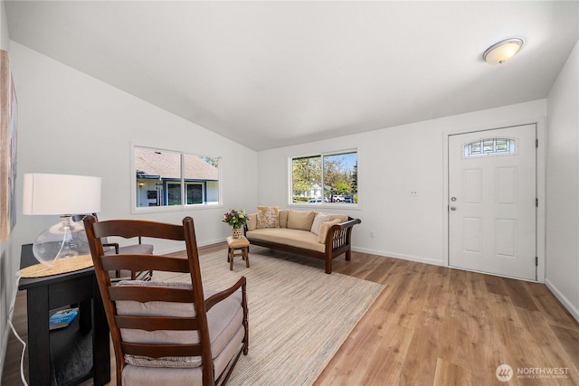 624 Geneva Ln SE, Olympia, WA 98513 - living area featuring light wood finished floors, vaulted ceiling, and baseboards