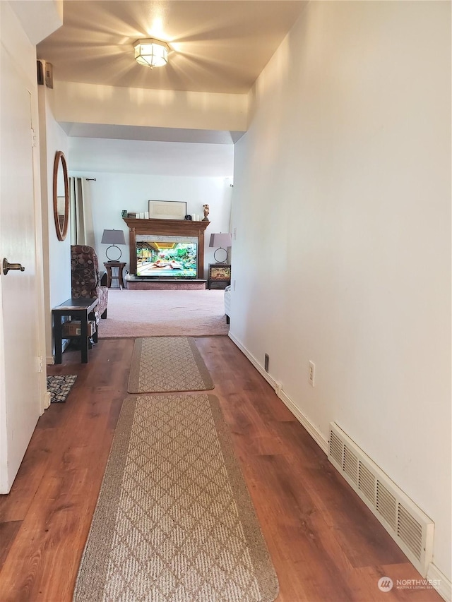 corridor with dark wood-type flooring