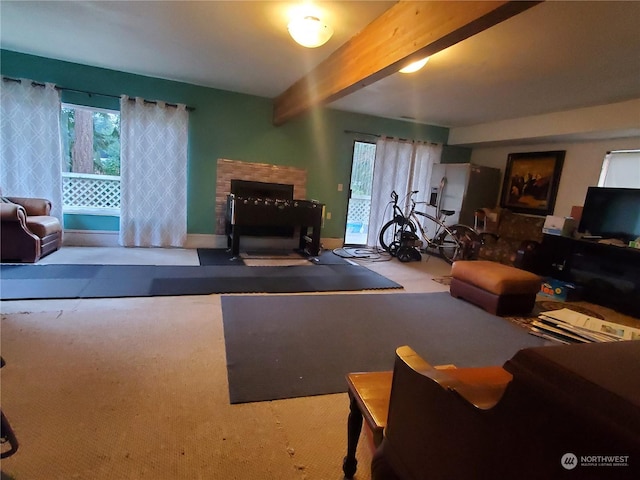 living room with light colored carpet and beam ceiling