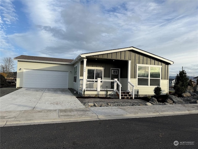 view of front of property with a garage and covered porch