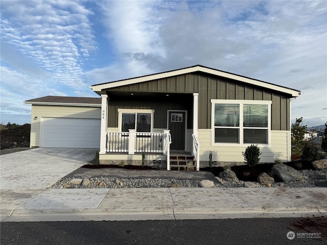 view of front facade with covered porch and a garage