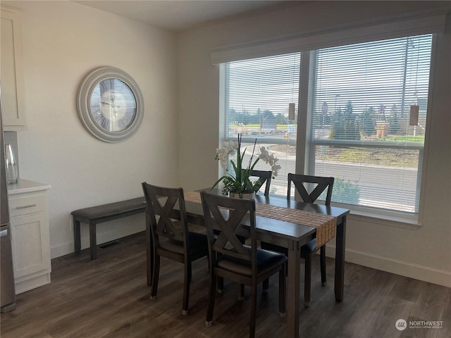 dining area featuring dark hardwood / wood-style flooring