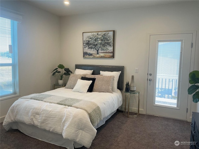 bedroom featuring dark carpet