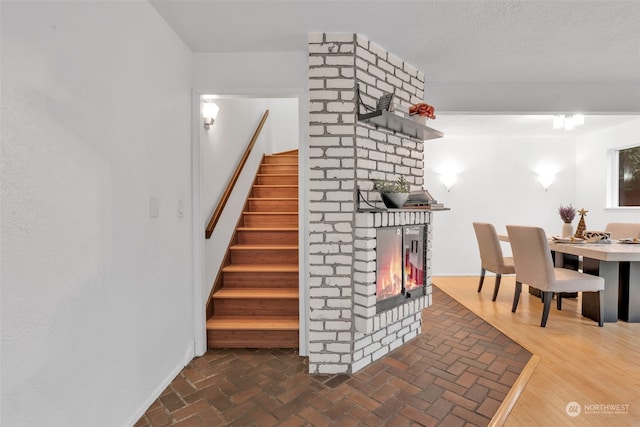 staircase with a fireplace