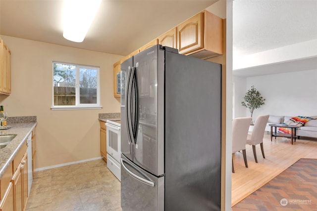 kitchen with stainless steel appliances and light brown cabinets