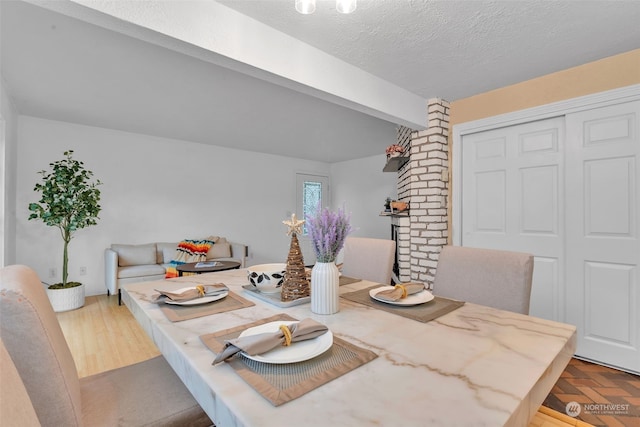 dining area with a textured ceiling