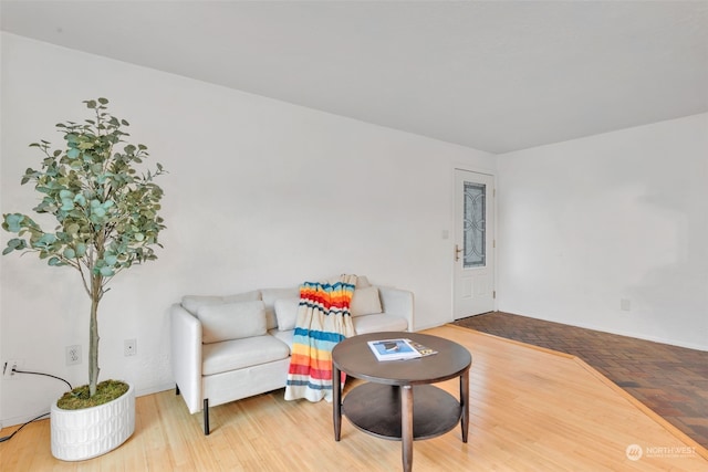 sitting room featuring hardwood / wood-style floors