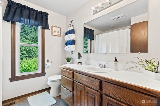 bathroom with vanity and toilet