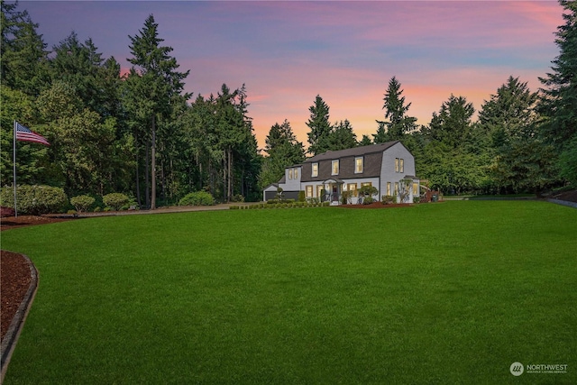 view of yard at dusk