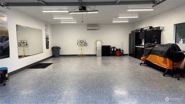 garage with a garage door opener and a wall mounted AC