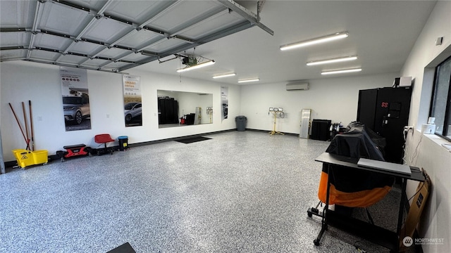 garage with a wall unit AC and a garage door opener