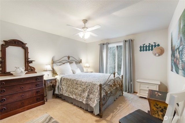 bedroom featuring light carpet and ceiling fan