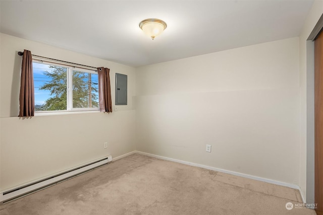 carpeted empty room featuring electric panel and a baseboard heating unit