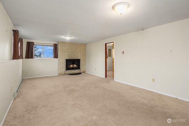 unfurnished living room featuring a brick fireplace, a baseboard heating unit, and light carpet