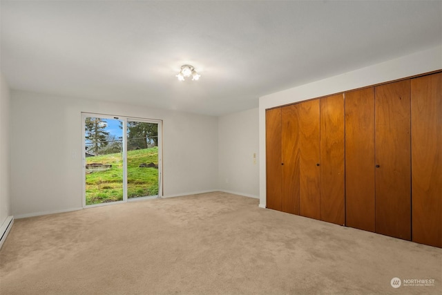 unfurnished bedroom featuring light colored carpet