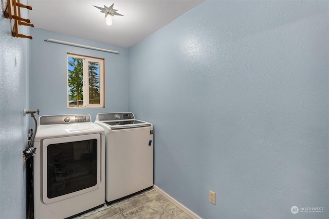 laundry area with separate washer and dryer