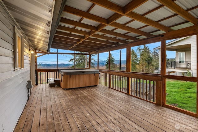 wooden deck featuring a hot tub