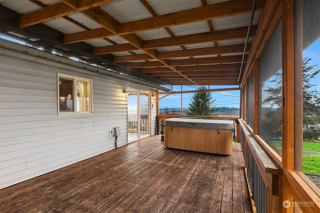 wooden deck featuring a hot tub