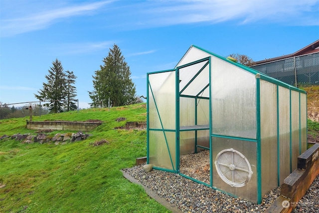 view of outdoor structure featuring a yard