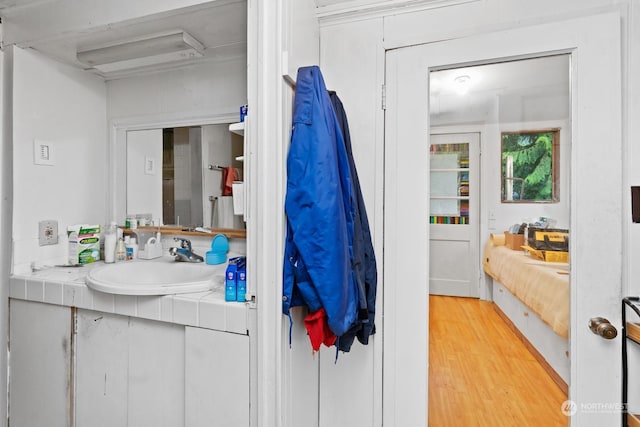 bathroom featuring hardwood / wood-style floors and vanity