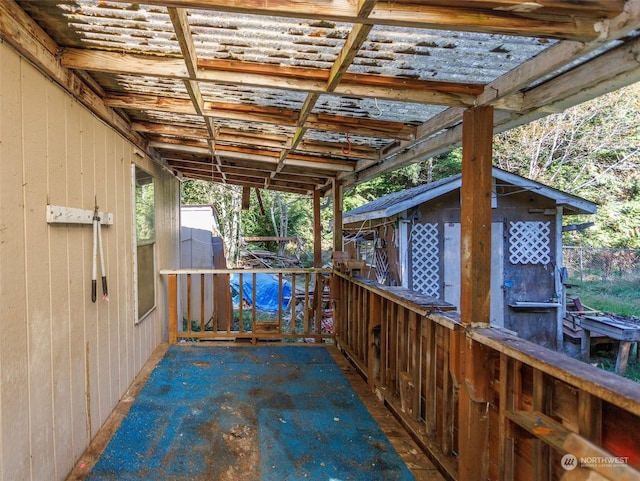 view of patio / terrace with a shed