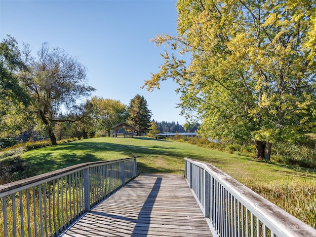 surrounding community with a lawn and a gazebo