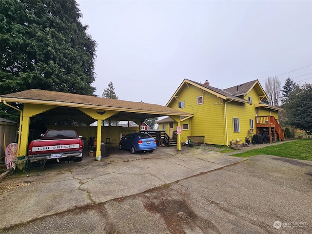 exterior space with a carport