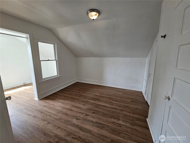 1651 S 35th St, Tacoma, WA 98418 - additional living space featuring lofted ceiling, dark wood-style floors, and baseboards