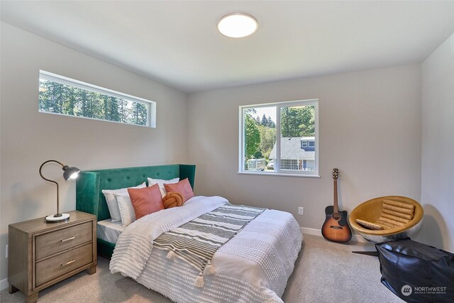 carpeted bedroom with baseboards