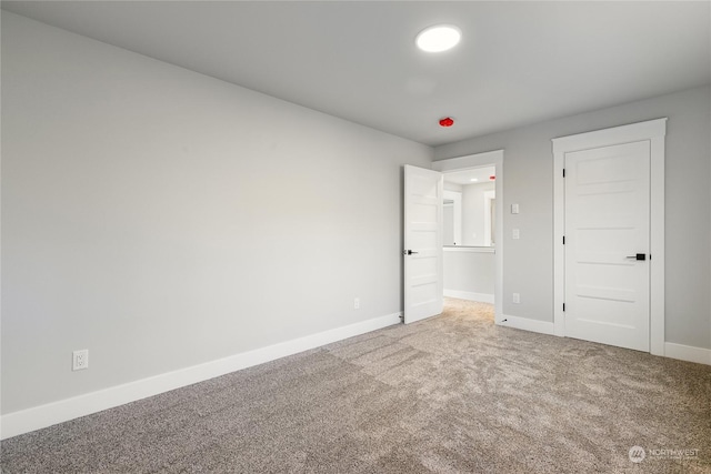 unfurnished bedroom featuring carpet flooring