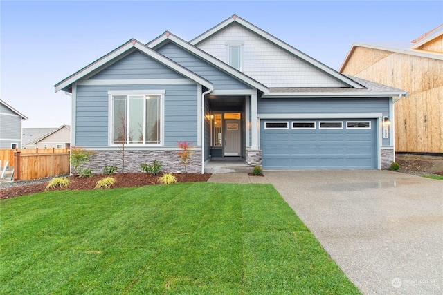 craftsman inspired home featuring a front yard and a garage