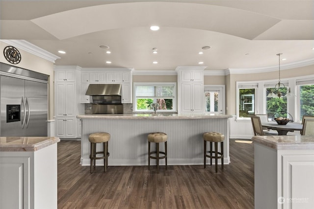 kitchen with white cabinetry and a spacious island