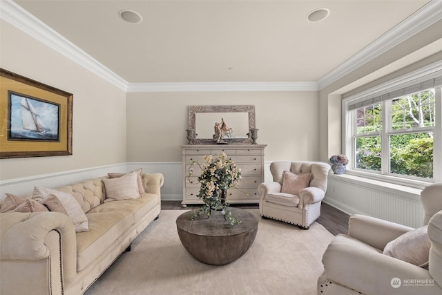 living room with wood-type flooring and ornamental molding