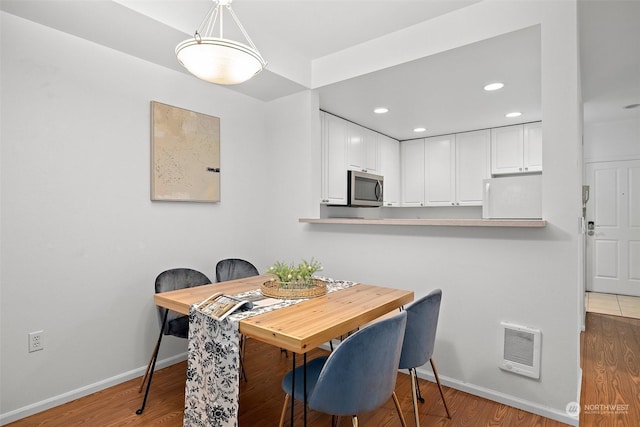 dining room featuring hardwood / wood-style floors