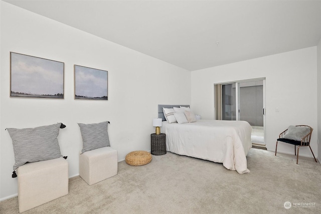 bedroom featuring light colored carpet