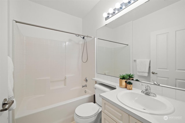 full bathroom featuring toilet,  shower combination, and vanity