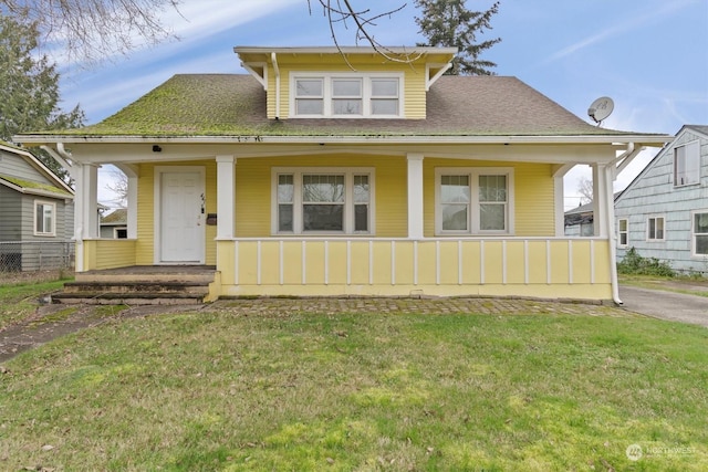 bungalow-style home featuring a front yard and a porch