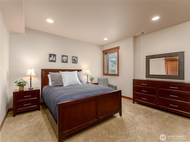 bedroom featuring recessed lighting, light colored carpet, visible vents, and baseboards