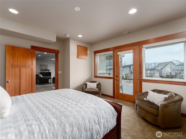 carpeted bedroom featuring visible vents, recessed lighting, and french doors