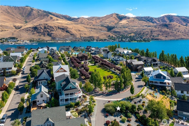 aerial view with a residential view and a water and mountain view