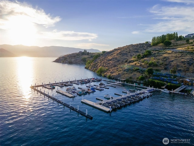 view of dock featuring a water and mountain view